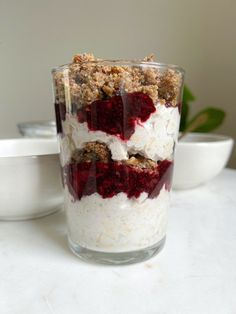 a dessert in a glass on top of a table