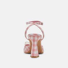 From our For Love & Lemons collab, a day-time occasion heel made for sun-drenched dressing. LOISE’s ‘90s era silhouette features sharp angles and a squared toe completed with a delicate bow. Choose from summery gingham colorways or a touch of textured raffia. Textile + Synthetic Upper Synthetic Outsole Synthetic Lining Leather Sock 3.4" Heel Height Imported Pink Round Toe Heels For Summer, Pink Block Heel Spring Heels, Pink Block Heel Shoes For Spring, Pink Block Heel Heels For Spring, Pink Heels With Heel Strap For Summer, Spring Pink Block Heel Shoes, Trendy White Heels For Spring, White Retro Heels For Summer, White Retro Summer Heels