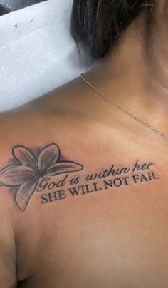 a woman with a tattoo on her chest saying god is within her she will not fail