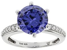 Charles Winston For Bella Luce ® tanzanite and white diamond simulants 6.30ctw round, rhodium over sterling silver ring. Measures approximately 0.81"L x 0.50"W and is not sizable. Tanzanite Diamond Ring With Diamond Accents, Tanzanite Diamond Ring With Accents, Diamond Jewelry Designs, Jtv Jewelry, Man Made Diamonds, Diamond Simulant, Gemstone Colors, Natural Crystals, White Diamond