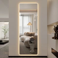 a living room filled with furniture and a large mirror in the middle of it's wall