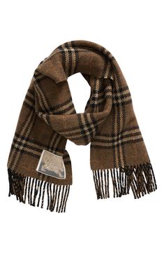 Woven on traditional looms at a centuries-old Scottish mill, this reversible Burberry Check-to-herringbone scarf is then washed in spring water and brushed for luxurious softness. 69" x 11 3/4" Reversible 61% cashmere, 39% wool Dry clean Made in the UK Brown Plaid Scarf, Aesthetic Scarf, Burberry Aesthetic, Aspen Trip, Herringbone Scarf, Scarf Aesthetic, Scarf Burberry, Luxury Scarf, Things I Need To Buy