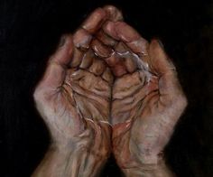 two hands are holding something in their palms on a black background, with one hand folded over the other