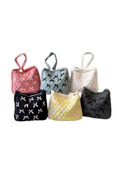 The Little Bows Tote is a playful and practical addition to your wardrobe. Made of quilted nylon with bow accents, this cross body bag features a full zipper closure and a lined body for added security. The internal zipper pocket keeps your belongings organized, while the strap drop of 15" is perfect for everyday use. Approximately 14" L X 13" T X 3" D. Beaded Pouch, Makeup Pouch, Scarf Jewelry, Pouch Bag, Cross Body Bag, Ring Bracelet, Earring Necklace, Body Bag, Travel Bags