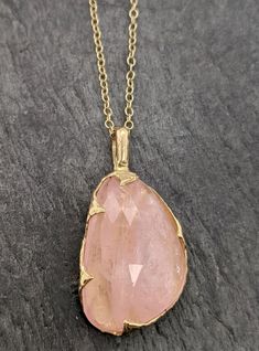 "Fancy cut pink Morganite 18k gold Pendant Gold Necklace gemstone Jewelry byAngeline Morganite feels so soft, gentle and loving. I hand carved this pendant in wax and cast it in solid gold using the lost wax casting process. This one of a kind pendant comes on a solid 18k 18\" chain. The stone measures about 16x25mm. If you don't need a chain for the Pendant please ask about a price reduction to ship w/o chain. Throughout all time and history, in every tribe and culture all around the world crys Exquisite Pink Pendant Necklace, Delicate Pink Gold Pendant Jewelry, Fine Jewelry Gold With Large Stone, Gold Fine Jewelry With Large Stone, Exquisite Pink Gemstone Necklaces, Exquisite Pink Gemstone Necklace, Pink Oval 14k Gold Necklace, Luxury Pink Briolette Necklace, Fine Gold Morganite Jewelry