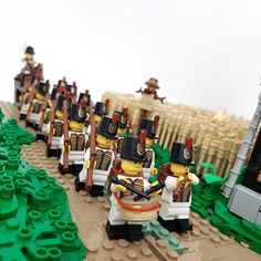 several lego soldiers are lined up in formation