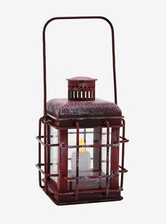 a red lantern with a candle in it on a white background, there is no image here to provide a caption for