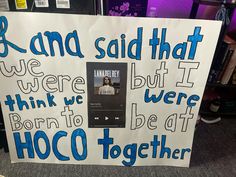 a white sign with blue writing on it that says, and said that we were not born to be at hoco together