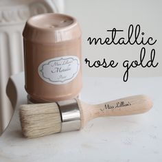 there is a paint brush next to a jar with rose gold on it and the words metallic rose gold