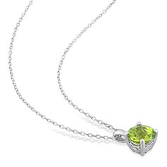 Add a pop of serene color to her attire with this green peridot solitaire pendant and stud earrings set in silver. Crafted in sterling silver Each piece glistens with a 7.0mm round spring-green peridot solitaire - the traditional birthstone for August that is said to bring fame, dignity and protection. Open heart-shaped details along the setting of each earring are a sweet touch. The pendant suspends along an 18.0-inch cable chain that secures with a spring-ring clasp. These post earrings secure Fine Jewelry Lime Green Birthstone, Fine Jewelry Lime Green Gemstone, Classic Peridot Birthstone Jewelry, Green Peridot Jewelry With Prong Setting, Classic Peridot Jewelry With Prong Setting, Classic Peridot Jewelry For May Birthstone, Peridot Solitaire Jewelry For May Birthstone, White Gold Peridot Jewelry With Birthstone, Fine Jewelry With Round Cut Peridot