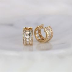 Our new Ramona earrings are chic hoop stunners that can be paired with any outfit! #earrings #gold #diamond #baguette #round #pave #hoopearrings #diamondearrings #vintage #artdeco #jewelry #finejewelry #gifts Baguette Hoop Earrings, Hoop Diamond Earrings, Baguette Diamond Earrings, Radiant Cut Rings, Baguette Earring, Pave Diamond Earrings, Diamond Baguette, Diamond Huggies, Bridal Ring Sets