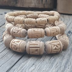 📿 This elegant, beautiful Tulsi Bracelet says Radha in Devanagari Script on each Barrel-shaped Tulsi beads. This Divine Bracelet helps to purify the mind, body as well as the soul of a person. It radiates positive vibes in the aura of a person and helps him get rid of all forms of negative energy. 🚪 Pure Tulsi Japa Beads Sourced from Vrindavan 🚪 🤚 Our bracelets are beautifully crafted & made of high-quality natural beads. These will give you a refreshing feeling, enhance your power & relaxat Adjustable Carved Bracelets With Round Beads, Spiritual Carved Beaded Bracelets, Adjustable, Spiritual Carved Round Bracelets, Spiritual Round Carved Bracelets, Spiritual Carved Beaded Bracelets, Adjustable Carved Beaded Spiritual Bracelets, Adjustable Carved Beaded Bracelets For Spiritual Style, Adjustable Carved Round Bracelets, Adjustable Carved Bracelets