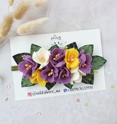 some flowers are laying on top of a card