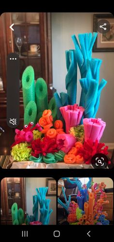 some very pretty colorful flowers and plants in the middle of a table with pictures on it