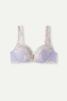 Wireless Gioia super push-up bra with heavily padded graduated molded cups. It is made with a sophisticated and elegant stretch lace that features either a tone-on-tone or contrast color floral embroidery, depending on the version presented. The straps are finished with lace are adjustable in back. Ideal design to achieve a two-sizes-larger effect to create a breathtaking décolleté.
The model is 5’ 9” (175 cm) tall and is wearing a size 2B / 75B / 34B / 85B / 42B.

Jennifer Lopez, the brand’s gl Elegant Lace Padded Bra, Lace Push-up Bra With Lace Closure, Elegant Padded Push-up Bra, Elegant Padded Low-cut Bra, Elegant Low-cut Padded Bra, Push-up Bra With Padded Cups For Wedding, Delicate Lace Push-up Bra, Lace Push-up Bra With Lace Trim, Lace Push-up Bra For Wedding