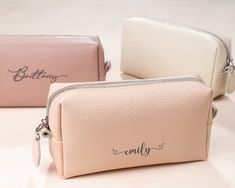 "This personalized cosmetic  bag is sure to melt every modern woman`s heart because it combines quality material, functional style, and sophisticated appearance. You can customize a cosmetic bag with small monogram or name, waterproof lining with a small internal pocket, and gorgeous colors to make it a unique and intimate bridesmaid proposal gift your girls will cherish for years. Minimalist but very practical, this daily and travel makeup bag holds as much as needed, remaining very compact, wh Personalized Rectangular Cosmetic Bag Gift, Personalized Cosmetic Pouch Bag, Personalized Pouch Cosmetic Bag, Personalized Pouch Cosmetic Bag For Daily Use, Personalized Zipper Pouch Cosmetic Bag, White Rectangular Cosmetic Bag For Gift, White Rectangular Cosmetic Bag As Gift, White Rectangular Cosmetic Bag Gift, Elegant Personalized Bags For Gifts