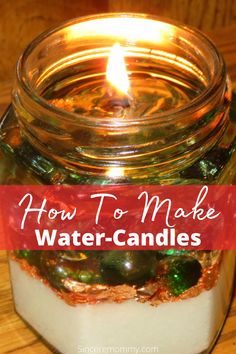 a jar filled with candles sitting on top of a wooden table next to a red and white sign that says how to make water - candles