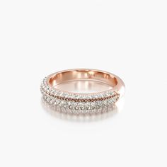 a gold ring with three rows of diamonds