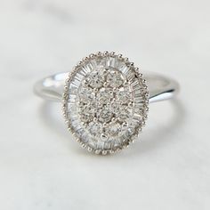 a white gold and diamond cluster ring