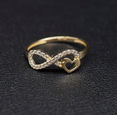 "14k Real Solid Yellow Gold Infinity Heart Ring, 14k Solid Gold Women Heart Ring, Infinity Symbol Gemstone Gold Ring for Women, Gift,  Gold Ring, Minimalist Ring * Metal : Real 14K Yellow Gold, (Properly Stamped, 14K)  * Condition : Brand New * Finish : Polished * Band thickness: 1.5 mm  * infinity Size: 17 mm length, 7mm width * Scale: : 6,5US, 7US, 7.5US,8US, 8.5US * Stone: Cubic Zirconia These Rings are 100% Authentic 14K Solid Real Gold .  \"Not Plated or Filled\" This is a Beautiful Genuine Real 14K Solid Gold  Infinity Ring BOSPHORUSGOLD" Infinity Heart Ring, Infinity Gold Rings For Women, Infinity Rings Gold, Infinity Heart Ring For Valentine's Day Anniversary, Infinity Gold Ring, Valentine's Day Infinity Heart Ring For Anniversary, Gold Infinity Ring For Valentine's Day, Gold Sterling Silver Heart Ring With Diamond Accents, Infinity Promise Ring For Valentine's Day