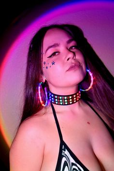 Expand your glow-filled wardrobe with the LED Choker Necklace. This colorful accessory features bright LED lights that respond to music, flashing and glittering to the beat of your favorite songs. Adjustable around your neck, this choker sits comfortably, and the battery pack fits comfortably on your back, so you hardly notice it's there. This quality-crafted sound-reactive LED Choker Necklace is a must for night concerts, festivals, and rave parties. It has bright, colorful lights that glitter Rave Jewelry For Music Festival With Adjustable Fit, Trendy Neon Jewelry For Party, Multicolor Rave Jewelry For Party, Black Glow In The Dark Jewelry For Parties, Black Glow In The Dark Party Jewelry, Rave Multicolor Choker For Festivals, Rave Style Multicolor Choker, Constellation Earrings, Colorful Lights