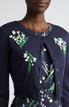 Delicate bell-shaped blooms accentuated with pearly baubles blossom across this three-quarter-sleeve cardigan knit from a blend of silk and cotton. Front button closure Jewel neck Three-quarter sleeves 55% silk, 45% cotton Dry clean Imported Designer Clothing Hispanic & Latinx Owned/Founded Embellished Cardigan, Crop Cardigan, Cardigan Knit, Jewel Neck, Sleeve Cardigan, Cropped Cardigan, Lily Of The Valley, Carolina Herrera, Three Quarter Sleeves