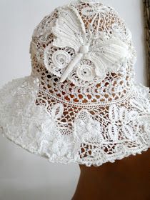 a woman wearing a white hat with lace on it