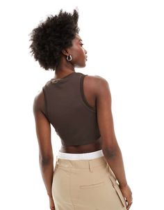 Top by Nike Next stop: checkout Crew neck Nike logo embroidery Racer back Slim fit Brown Stretch Sleeveless Crop Top, Brown Fitted Cropped Tank Top, Trendy Brown Sleeveless Crop Top, Casual Brown Sleeveless Crop Top, Brown Stretch Crop Top, Trendy Fitted Brown Tank Top, Brown Ribbed Tank Top For Summer, Casual Brown Cropped Tank Top, Trendy Ribbed Brown Tank Top