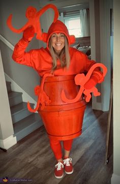 a woman dressed as a lobster in a bucket