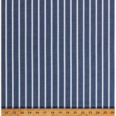 a blue and white striped fabric with a ruler on the bottom right hand side that says,