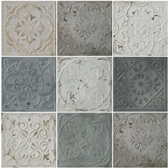 several different types of decorative tiles in various colors and sizes, including white, gray, grey