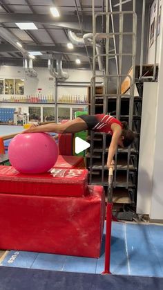 a woman is doing exercises on an exercise ball in the middle of a gym floor