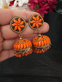 Complete your look this festive season with our lightweight and colorful chandelier jhumka earrings in orange color and antique polish! A gorgeous pair of jhumka earrings to light up your day any time! In stock and ready to ship. Color : orange Note :Color, shades, texture displayed may slightly vary from the actual product due to digital image limitations. We request you to consider these minor variations. Please expect the possibility of some slight imperfections when buying handmade jewelry. Orange Earrings Indian, Small Jhumka, Colorful Chandelier, Earrings Kundan, Pakistani Earrings, Navratri Collection, Terracotta Earrings, Jewelry Pakistani, Kundan Jewelry