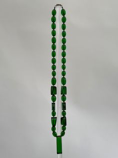 "This very stylish 1930s Art Deco necklace is made from green coloured early plastic beads of varying sizes with a long faceted central bead to the middle.  When fully open and laid flat it measures 28\" inches, the central bead measures 2\" inches long, please check that the size will meet your needs before you purchase.    It is in excellent overall condition, please see all the photos and zoom in for details." Display Mannequins, Art Deco Lady, 1930s Art, Necklace Beads, Art Deco Necklace, 1930s Art Deco, Plastic Beads, Pendant Necklaces, Jewelry Necklace Pendant