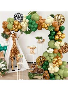 a giraffe and zebra themed balloon arch