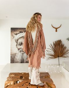 Alma Libra Linen Kimono Robe is a unique mix of boho, American Indian   and oriental elements into an alchemical Chintamani masterpiece. Made   out of soft pure linen, it comes in raw unbleached silver-grey color or   hand dyed delicate tints of pink, cream and strong, wholesome black.   From the front it reminds of classic Japanese kimonos with simple square   silhouette, but hey have long   slits on top, so that your hands show off completely Pink Kimono For Fall Vacation, Pink Fall Vacation Kimono, Bohemian V-neck Cardigan For Loungewear, Bohemian Long Sleeve Beach Outerwear, Bohemian Beige Long Sleeve Cover-up, Long Hippie Outerwear For Beach, Long Hippie Style Beach Outerwear, V-neck Outerwear For Beach Cover-up In Fall, Long Bohemian Outerwear For Beach