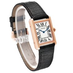 Cartier Tank Solo Silver Dial Rose Gold Steel Ladies Watch W5200024. Quartz movement. 18k rose gold 30.0 x 24.4 mm case with stainless steel caseback. Circular grained crown set with blue spinel cabochon. . Scratch resistant sapphire crystal. Opaline silver dial with black Roman numerals. Sword shaped blued steel hands. Secret Cartier signature at X. Black leather strap with an 18k rose gold tang buckle. Cartier Timeless Formal Jewelry And Watches, Cartier Timeless Jewelry And Watches For Formal Occasions, Timeless Cartier Jewelry And Watches For Formal Occasions, Elegant Cartier Watch With Subdials, Formal Yellow Gold Watch With Leather Strap, Elegant Cartier Watch Accessories With Subdials, Luxury Metal Dial Watch For Formal Occasions, Luxury Formal Watch Accessories With Leather Strap, Luxury Leather Strap For Formal Watches