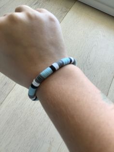 a person wearing a bracelet on their wrist