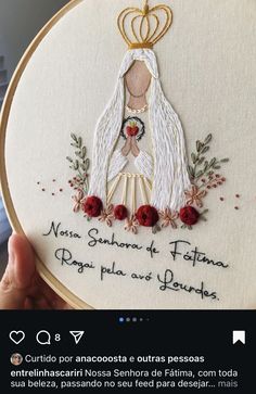 the embroidery pattern is being stitched on to a hoop with an angel in it