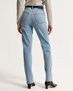 Our classic 90s straight jeans in a medium wash with a raw hem. This fit features an 11.5” ultra high rise, is fitted at top of body and eases through the thigh into a straight leg shape with a full-length inseam. This jean is made from our vintage stretch fabric which features both an authentic vintage look and contains slight built-in stretch for additional comfort. Classic Straight Cropped Jeans With Frayed Hem, Fitted Flare Jeans With Frayed Hem For Everyday, Classic Jeans With Frayed Hem For Fall, Classic High Rise Jeans With Frayed Hem, Fitted Flare Jeans With Frayed Hem In Rigid Denim, Fitted Flare Jeans With Tapered Leg In Rigid Denim, Classic Straight Flare Jeans With Frayed Hem, Fitted Straight Cropped Jeans In Rigid Denim, Fitted Straight Jeans For Spring