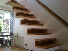 the stairs are made of wood and have no railings