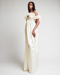 Our Off-Shoulder Cream Taffeta Gown with Juliette Sleeves by Madeline Marie combines classic elegance with contemporary style, making it a timeless addition to any wardrobe. The luxurious silk fabric drapes beautifully, while the off-shoulder design adds a touch of modern allure. Pair it with statement jewelry and elegant heels to complete your stunning look. This beautiful creme gown is made of taffeta. The sleeves are ruffled by elastic, you can wear these sleeves on the shoulder or off the sh Luxury Satin Gown With Pleated Bodice, Taffeta Ruffled Gown For Gala, Taffeta Gown With Ruffles For Gala, Voluminous Taffeta Dress For Formal Occasions, Taffeta Gala Gown With Ruffles, Voluminous Taffeta Formal Dress, Off-shoulder Evening Dress With Pleated Bodice For Wedding, Elegant Off-shoulder Gown With Pleated Bodice, Taffeta Gown With Ruffles For Formal Occasions