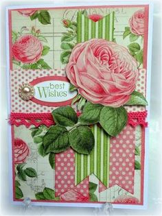 a card with pink roses and green leaves