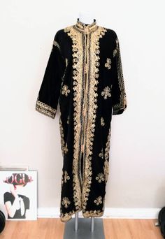 70s vintage velvet kaftan with golden embroidery original vintage handwork from Lebanon Suitable from S to L Very good and cultivated condition. Long Kaftan With Gold Embroidery For Festivals, Bohemian Kaftan With Gold Embroidery For Festive Occasions, Festive Bohemian Kaftan With Gold Embroidery, Long Kaftan With Gold Embroidery For Festive Season, Long Festive Kaftan With Gold Embroidery, Festive Long Kaftan With Gold Embroidery, Gold Embroidered Thobe For Festivals, Gold Abaya For Festivals, Long Gold Embroidered Abaya