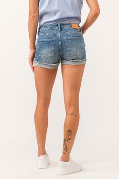 Classic denim mid rise shorts with cuffed hem. The flirt fit with a wink, sits a touch lower on the waist and playfull hugs every curve from hip and thigh. Shorts inseam on comfort stretch denim washed in marbleized netting effect, frayed hem details.9 1/4" Front Rise (include waistband), 22" Leg Opening, 3 1/4" inseam with 1" cuffed hem (Size 27) COMFORT STRETCH: Slightly snug, give sometime to ease in, may go up one size 97% COTTON 2% POLYESTER 1% SPANDEX Machine wash cold, Tumble dry low Impo Tencel Denim, Denim Essentials, Mid Rise Shorts, Cuffed Shorts, Medium Wash Jeans, Jogger Shorts, Comfy Sweaters, Sweater Sale, Light Wash Jeans