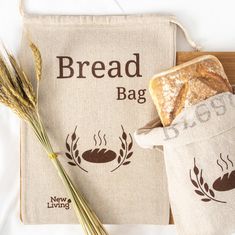 bread in a bag next to some wheat stalks on a cutting board with the words bread bag printed on it