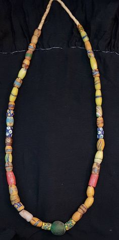 Its Beautiful Lovely Color of Ancient African Beads Wonderful Old Necklace it used to be called tribal Beads like in past they used instead of money Length 52cm Bohemian Single Strand Oval Beaded Necklaces, Traditional Multicolor Single Strand Beads, Traditional Single Strand Necklaces For Festivals, Traditional Single Strand Oval Beads, Traditional Single Strand Festival Jewelry, Bohemian Yellow Single Strand Beaded Necklace, Yellow Bohemian Single Strand Beaded Necklace, Traditional Single Strand Jewelry For Festival, Traditional Single Strand Beaded Necklace