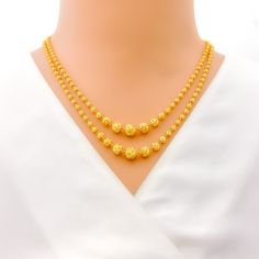 This exquisite 22k gold dotted Lara necklace set, weighing 33.7 grams, features a stunning yellow gold finish and a bold, poised design. The first row of the necklace measures 16 inches in length, while the last row measures 18 inches, with adjustable 0.6-inch links for a perfect fit. The set includes matching earrings, each 1.5 inches long with screw back posts and detachable hanging elements. Secured with a hook lock, this set is ideal for those who appreciate elegant and impactful jewelry, co Bridal Jewelry Necklace, Precious Stones Rings, Diamond Pendant Sets, Modern Bracelets, Fancy Necklace, Fancy Rings, Mens Gold Rings, Diamond Necklace Set, Traditional Earrings