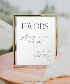 a sign that says favors please take one and thank you for the wedding with us