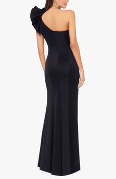 This smooth one-shoulder gown is sure to catch the eye of every onlooker as you pass through the party with a boldly ruffled detail. 58" length Back zip closure One-shoulder neck Single cap sleeve Lined 95% polyester, 5% spandex Dry clean Made in the USA One-shoulder Gown With Sweep Train For Evening, One-shoulder Evening Gown With Sweep Train, Evening One-shoulder Gown With Sweep Train, Evening Gown With Sweep Train And One Shoulder, Evening One Shoulder Dress With Sweep Train, Ruffled One Shoulder Evening Dress For Prom, One-shoulder Maxi Dress For Prom Gala, Formal One Shoulder Ruffle Dress For Prom, Formal One Shoulder Dress With Ruffles For Prom